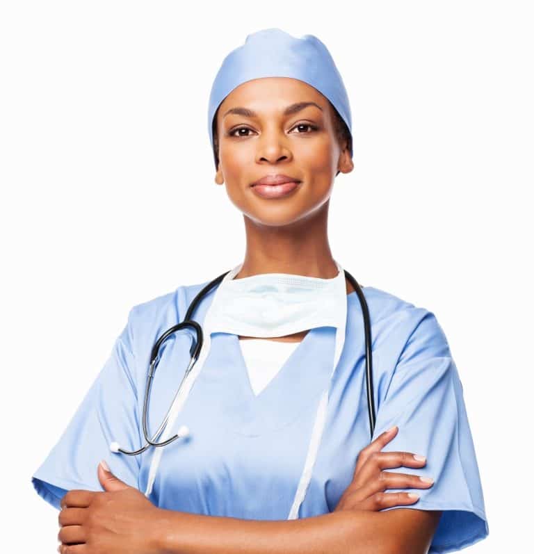 A medical professional wearing blue scrubs, a surgical cap, and a mask around the neck stands with arms crossed. A stethoscope is draped around the neck. The background is plain white.