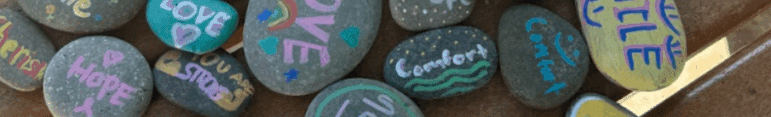 May contain painted rocks with words and designs.